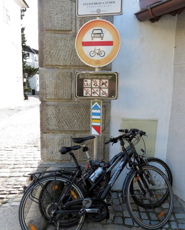 Bikes parked at road sign in Cesky Krumlov