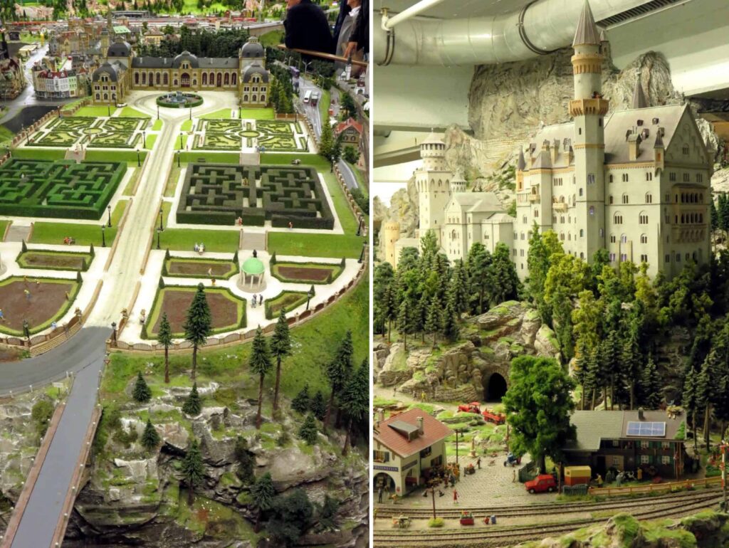 This miniature model, reminiscent of Miniatur Wunderland in Hamburg, Germany, features a castle with elaborate gardens on the left and a grand fortress atop a rocky hill on the right. Lush trees provide a natural frame, while a small railway station with trains adds life to the foreground.
